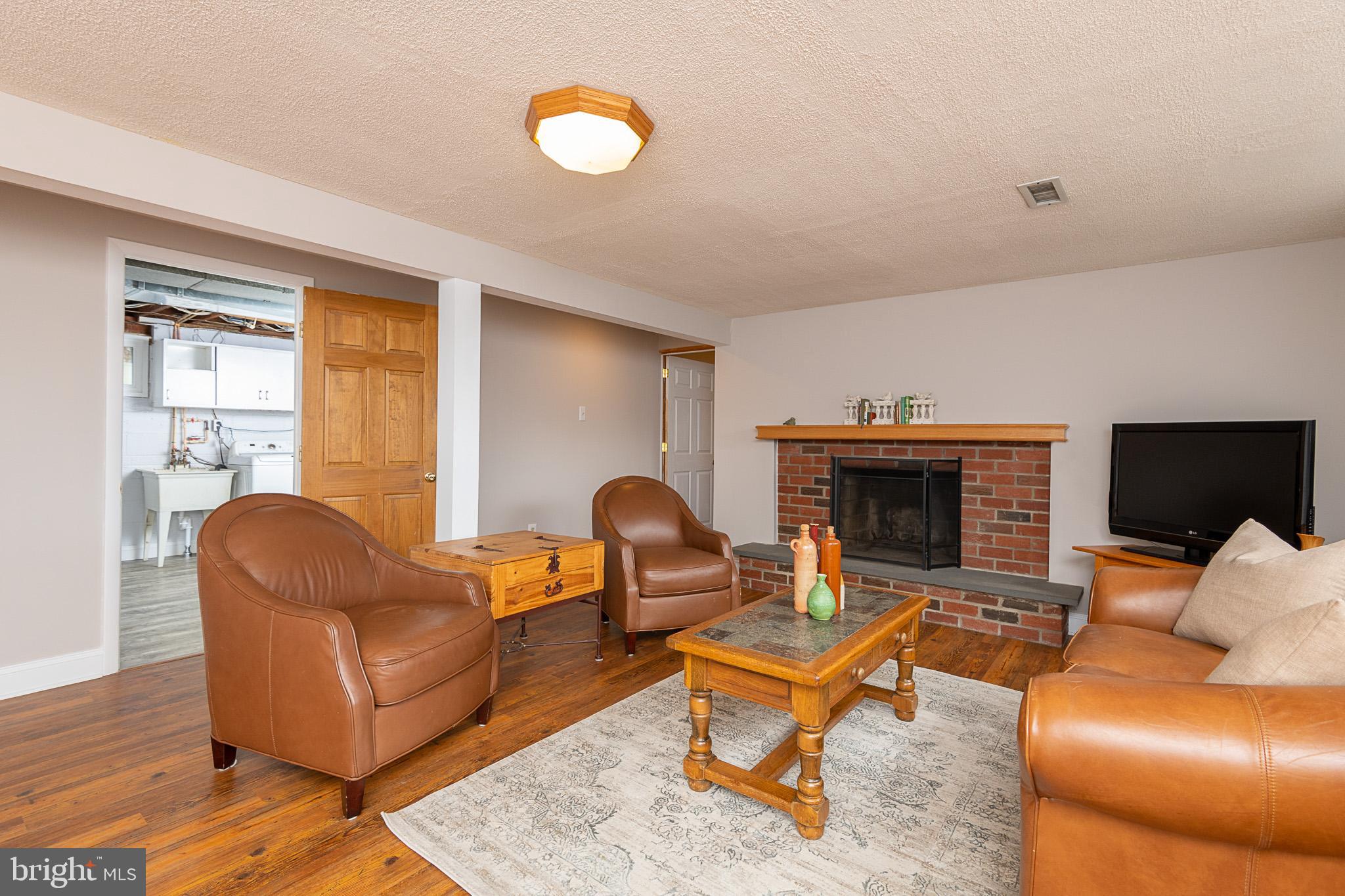 613 Howard Road West Chester, PA 19380 - Photo 18 of 25 Lower Level Great Room w/Wood Burning Fireplace