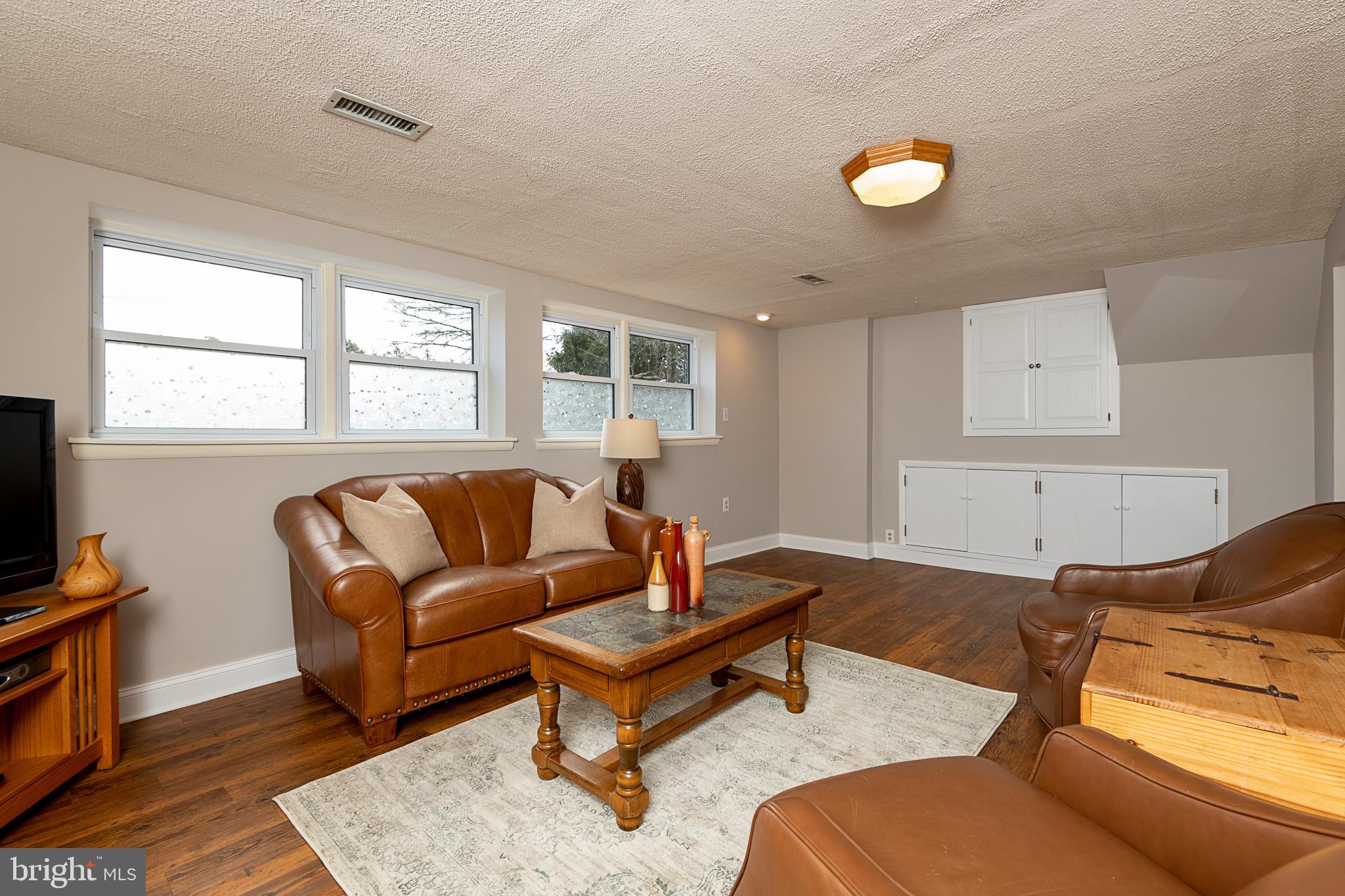 613 Howard Road West Chester, PA 19380 - Photo 19 of 25 Lower Level Great Room w/Wood Burning Fireplace