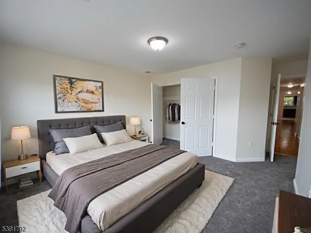 a spacious bedroom with a bed and a couch