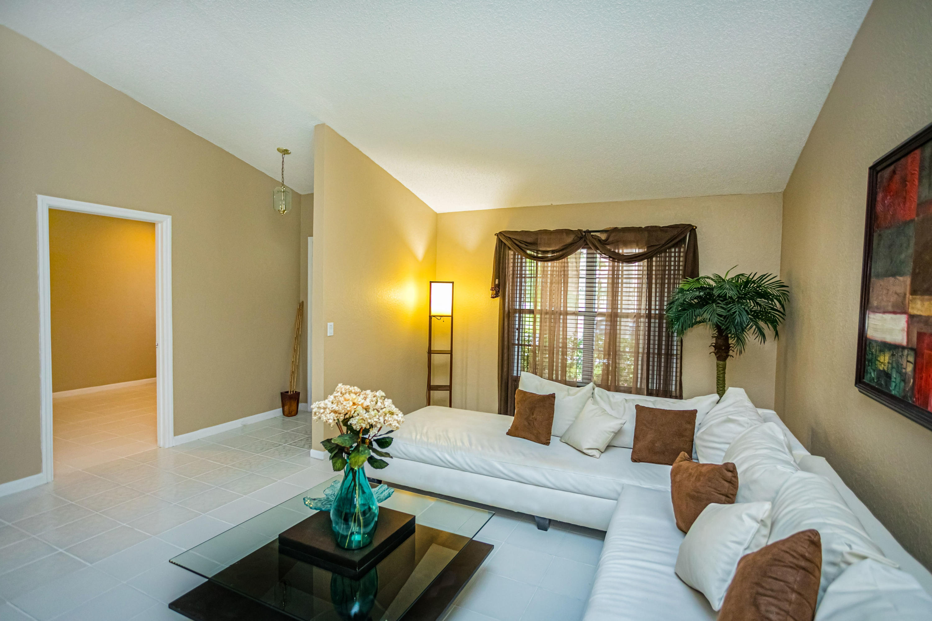 18248 Clear Brook Circle Boca Raton, FL 33498 - Photo 13 of 26 a living room with furniture and a potted plant