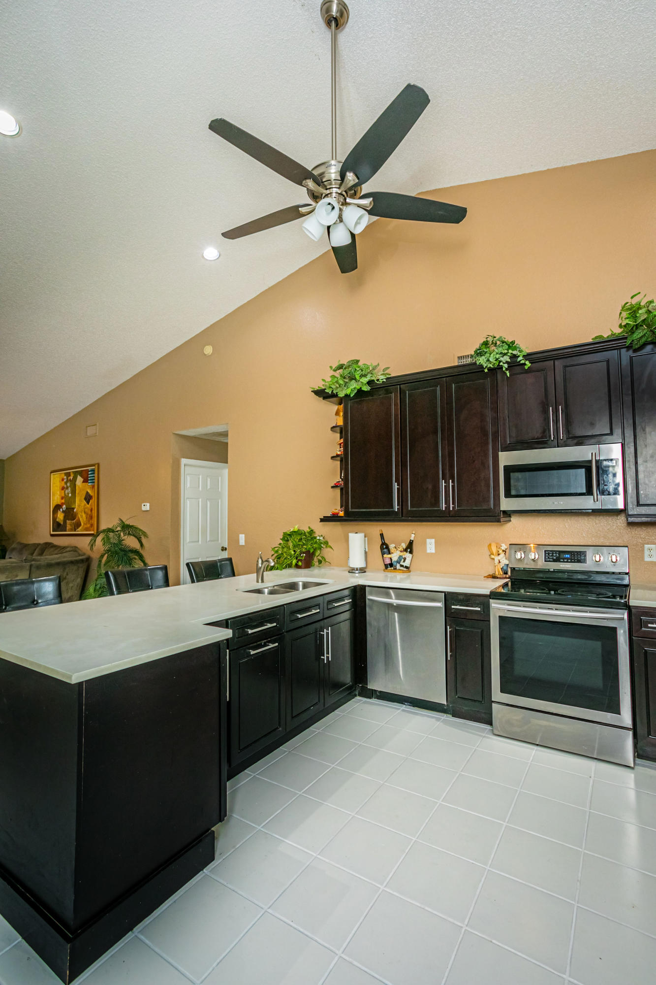 18248 Clear Brook Circle Boca Raton, FL 33498 - Photo 17 of 26 a kitchen with a sink and stove