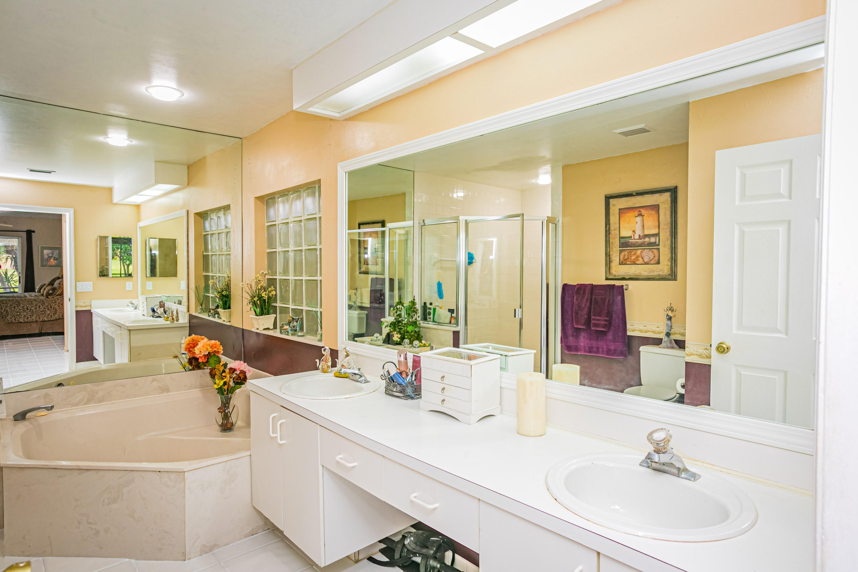 18248 Clear Brook Circle Boca Raton, FL 33498 - Photo 20 of 26 a bathroom with a sink double vanity and a mirror