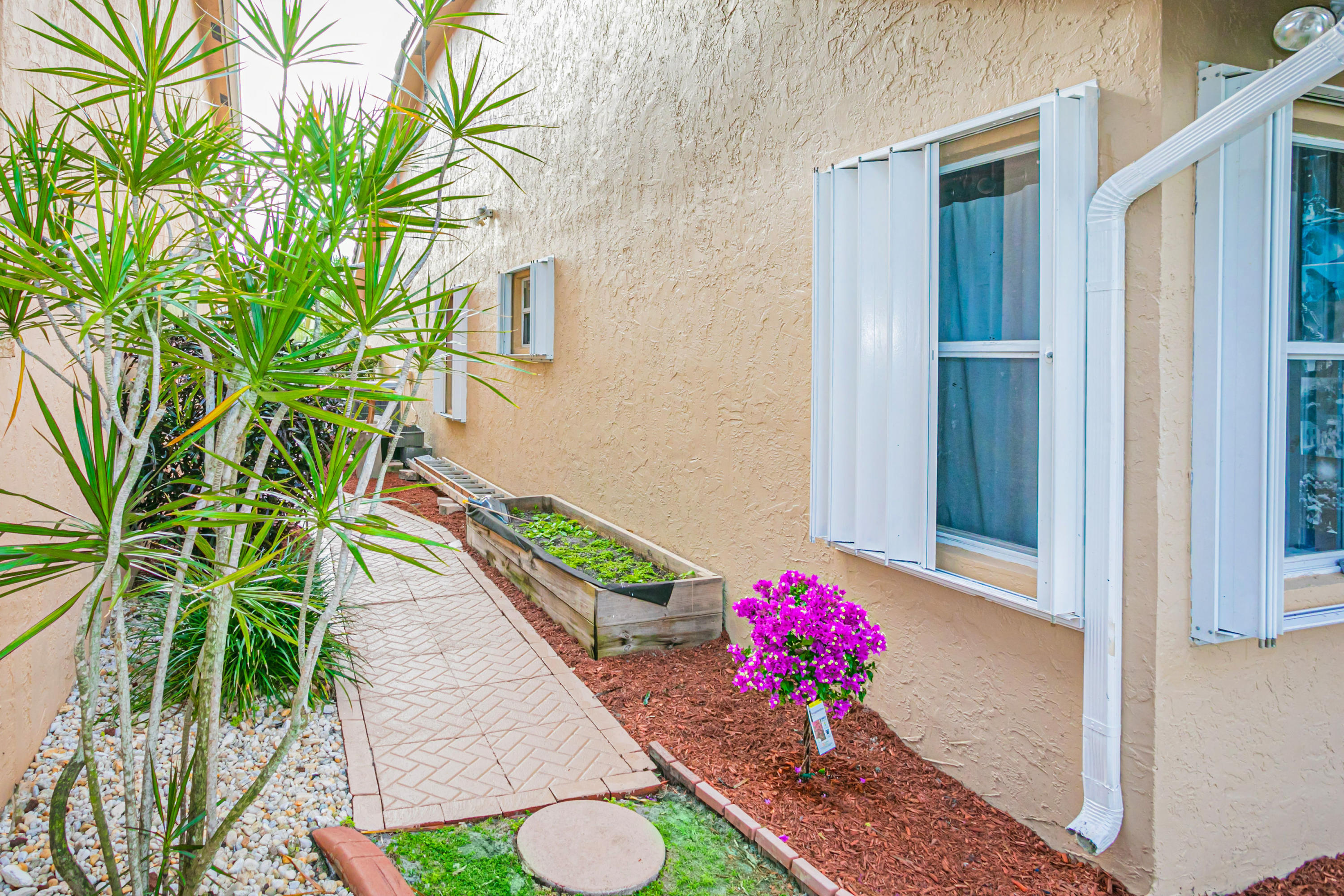 18248 Clear Brook Circle Boca Raton, FL 33498 - Photo 8 of 26 a view of a potted plants in front of a door