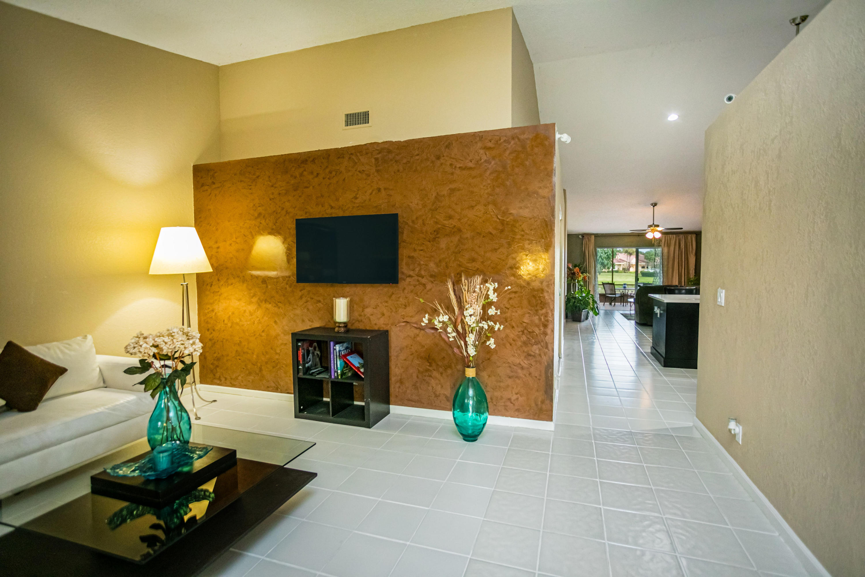 18248 Clear Brook Circle Boca Raton, FL 33498 - Photo 10 of 26 a living room with furniture and a flat screen tv