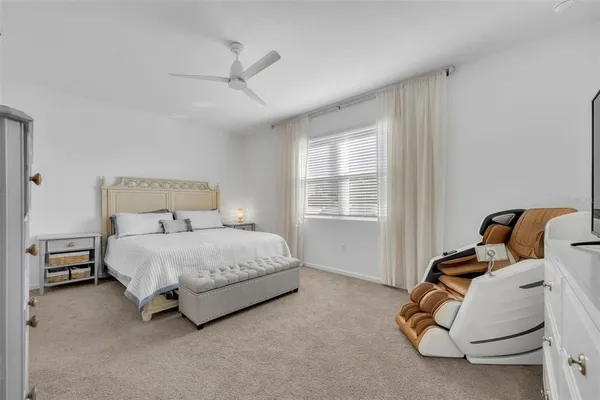 a bedroom with a bed and window