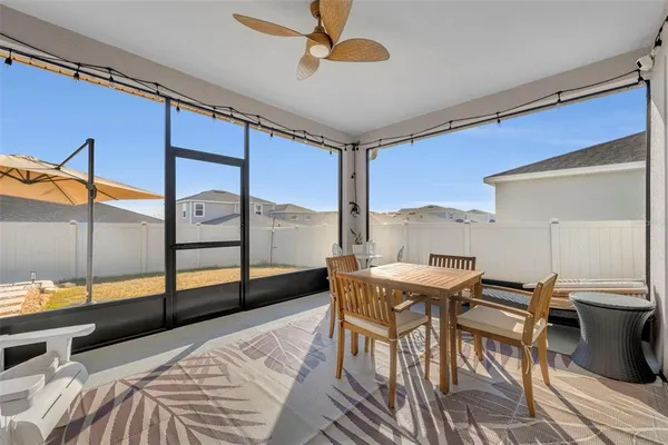a view of a bedroom with furniture and window