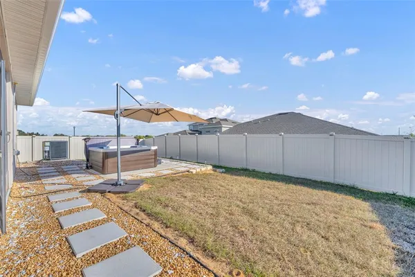 a view of a hall with wooden floor