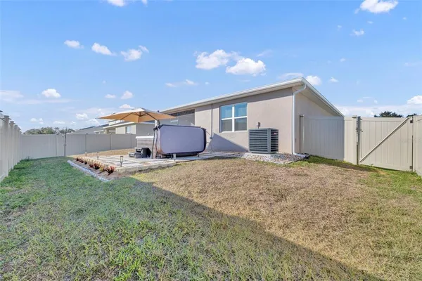 a house view with a backyard space