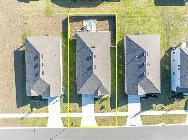 an aerial view of a house with swimming pool