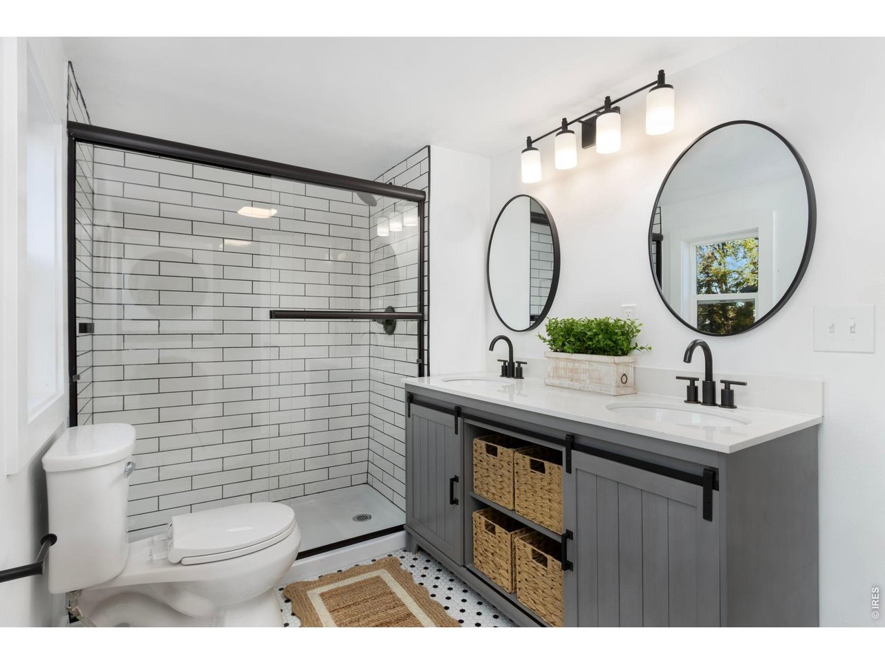 437 Clover Lane Fort Collins, CO 80521 - Photo 11 of 20 a bathroom with a toilet a sink and a mirror