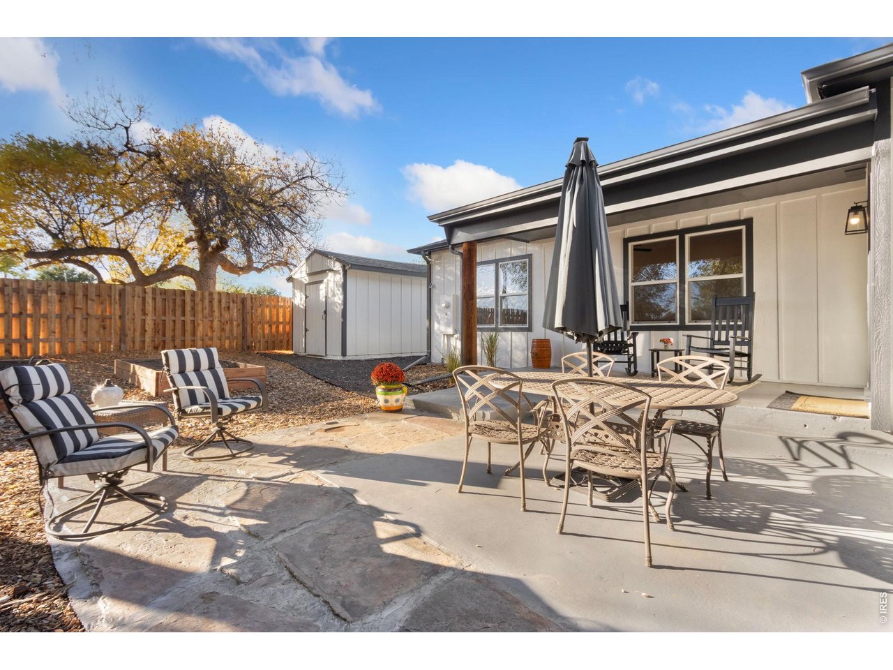 437 Clover Lane Fort Collins, CO 80521 - Photo 15 of 20 a view of a dinning table and chairs in the patio