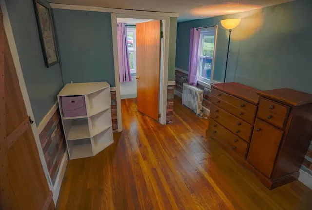 a living room with furniture and a mirror