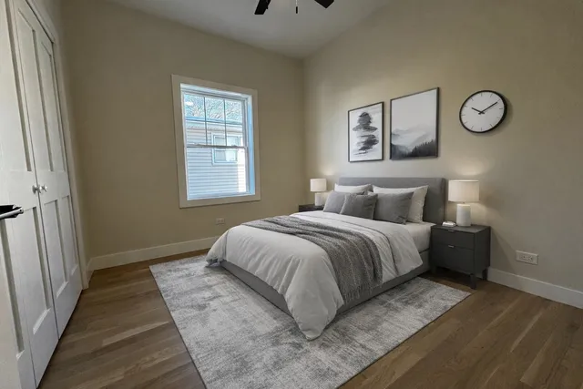 a bedroom with a bed and a window