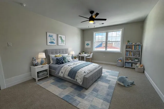 a spacious bedroom with a bed and a chandelier