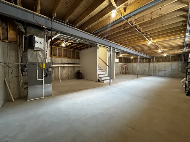 a view of empty room with wooden ceiling