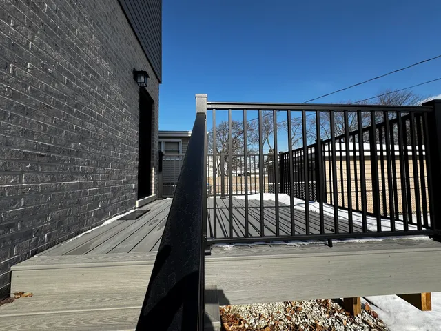 a view of a balcony with a floor to ceiling window