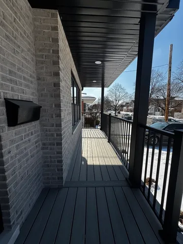 a view of balcony with wooden floor