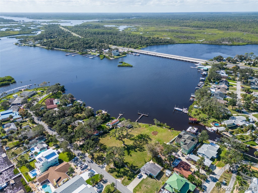 5952 Riverside Drive Port Orange, FL 32127 - Photo 11 of 27 an aerial view of ocean and residential houses with outdoor space