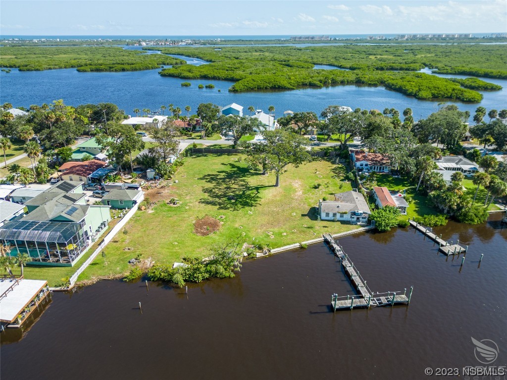 5952 Riverside Drive Port Orange, FL 32127 - Photo 17 of 27 an aerial view of a houses with a lake view