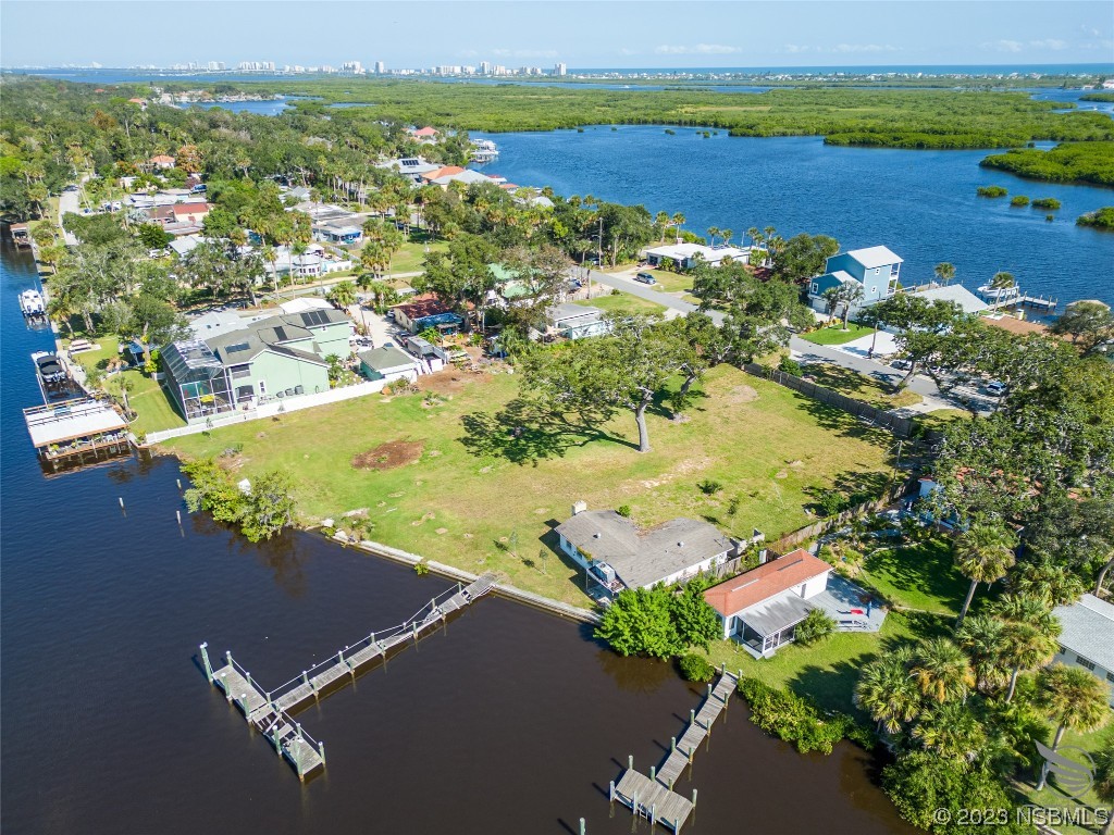 5952 Riverside Drive Port Orange, FL 32127 - Photo 22 of 27 an aerial view of a house with a lake view