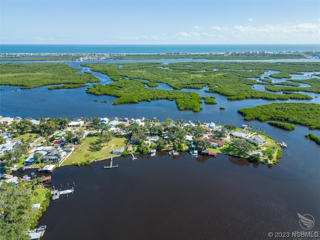 5952 Riverside Drive Port Orange, FL 32127 - Photo 25 of 27 an aerial view of a houses with a lake view