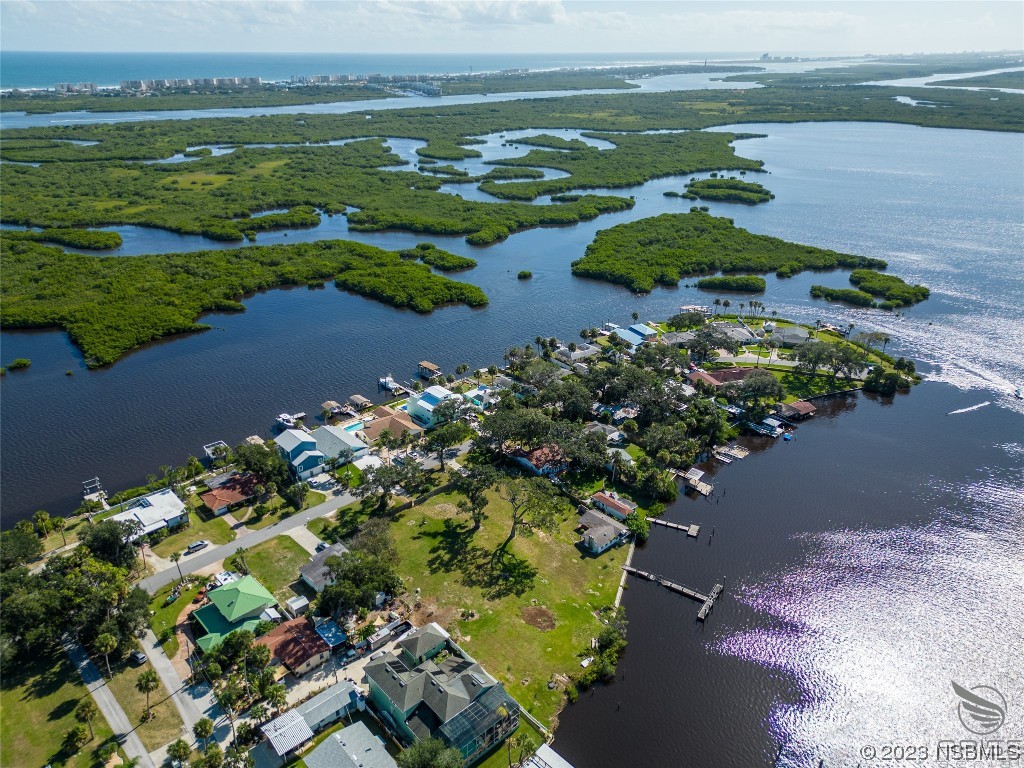 5952 Riverside Drive Port Orange, FL 32127 - Photo 4 of 27 an aerial view of ocean with residential house and outdoor space