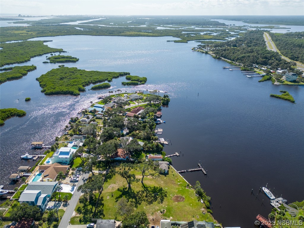 5952 Riverside Drive Port Orange, FL 32127 - Photo 5 of 27 an aerial view of lake and residential houses with outdoor space