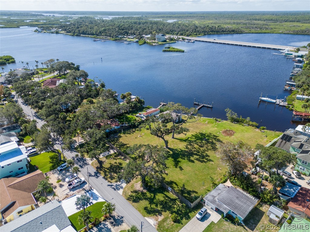 5952 Riverside Drive Port Orange, FL 32127 - Photo 9 of 27 an aerial view of a houses with a lake view