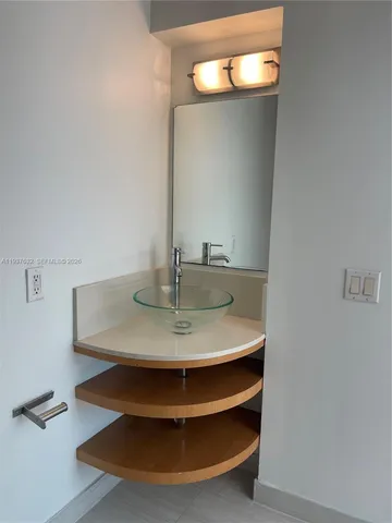 a view of a hallway with washer and dryer