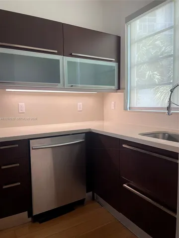 a kitchen with a sink and a window