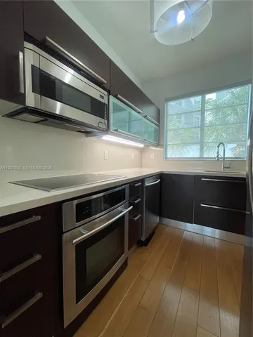 a kitchen with a stove and a microwave