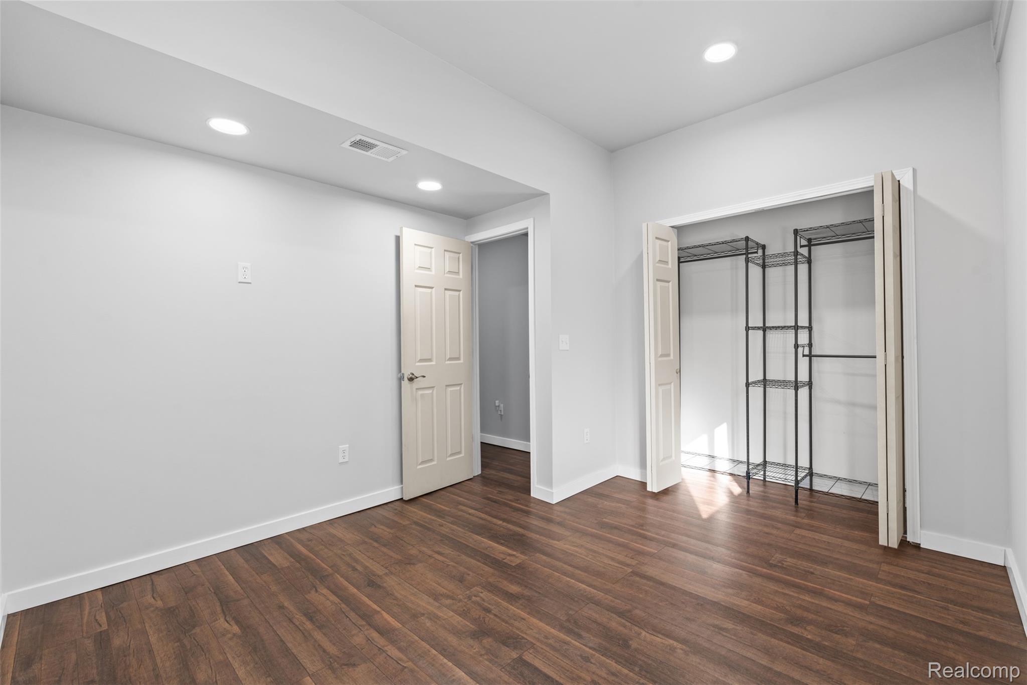 7670 Mi State Road Manchester, MI 48158 - Photo 11 of 53 Unfurnished bedroom featuring recessed lighting, a closet, and dark wood-style floors