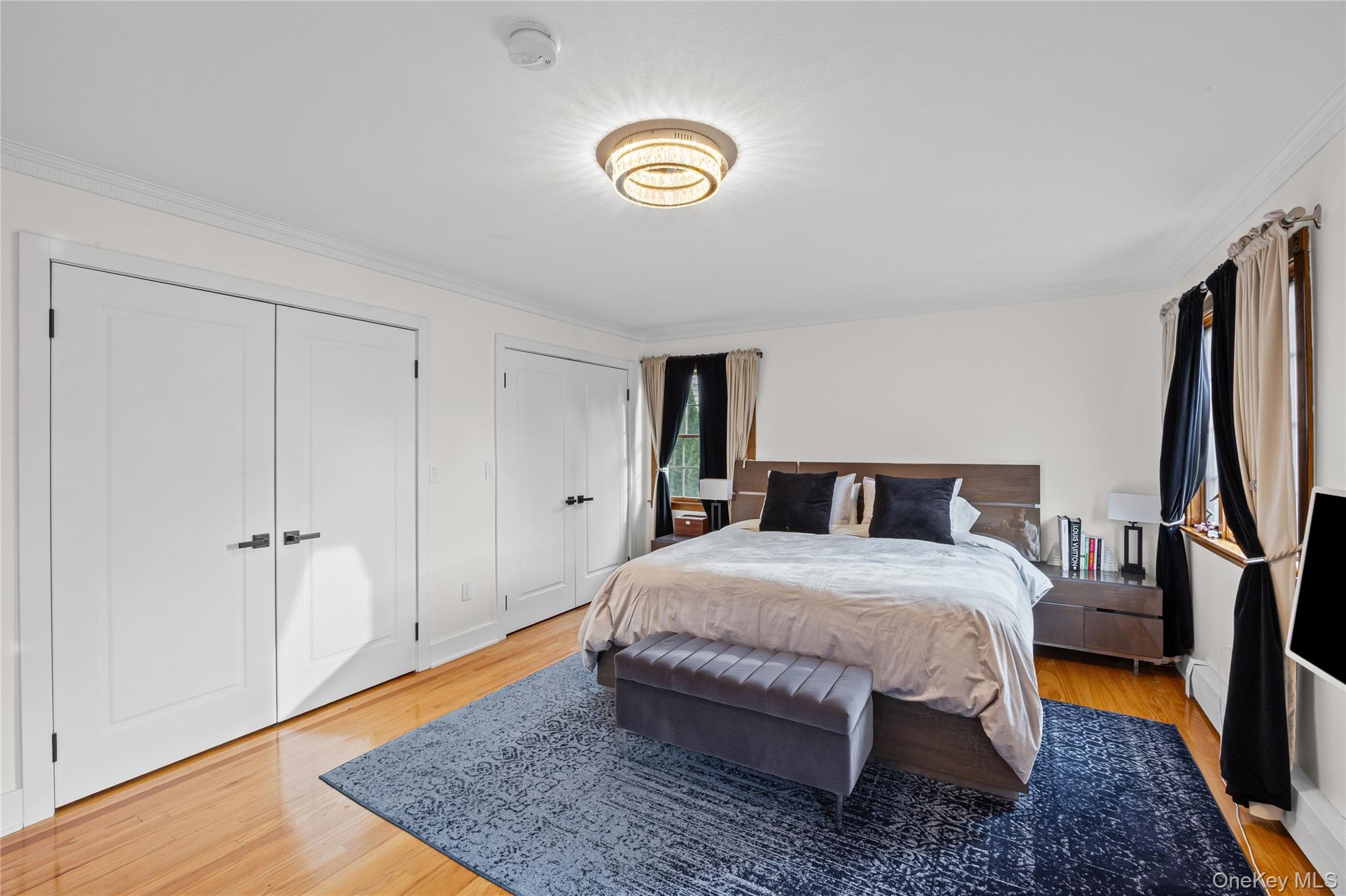 8 Willow Road New Hyde Park, NY 11040 - Photo 14 of 34 a bedroom with a bed and a dresser