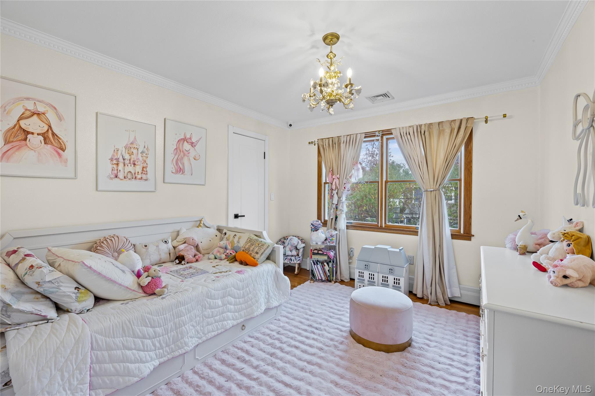8 Willow Road New Hyde Park, NY 11040 - Photo 19 of 34 a bedroom with a bed and wooden floor