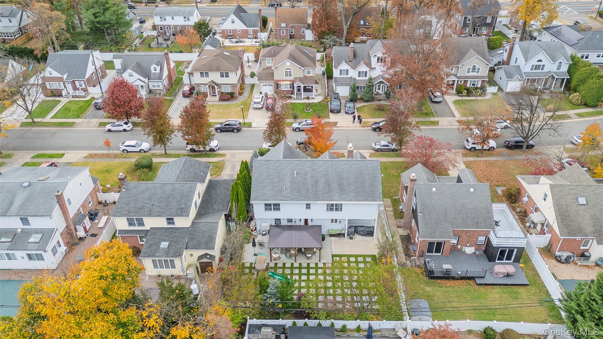 8 Willow Road New Hyde Park, NY 11040 - Photo 32 of 34 an aerial view of residential houses with outdoor space and swimming pool