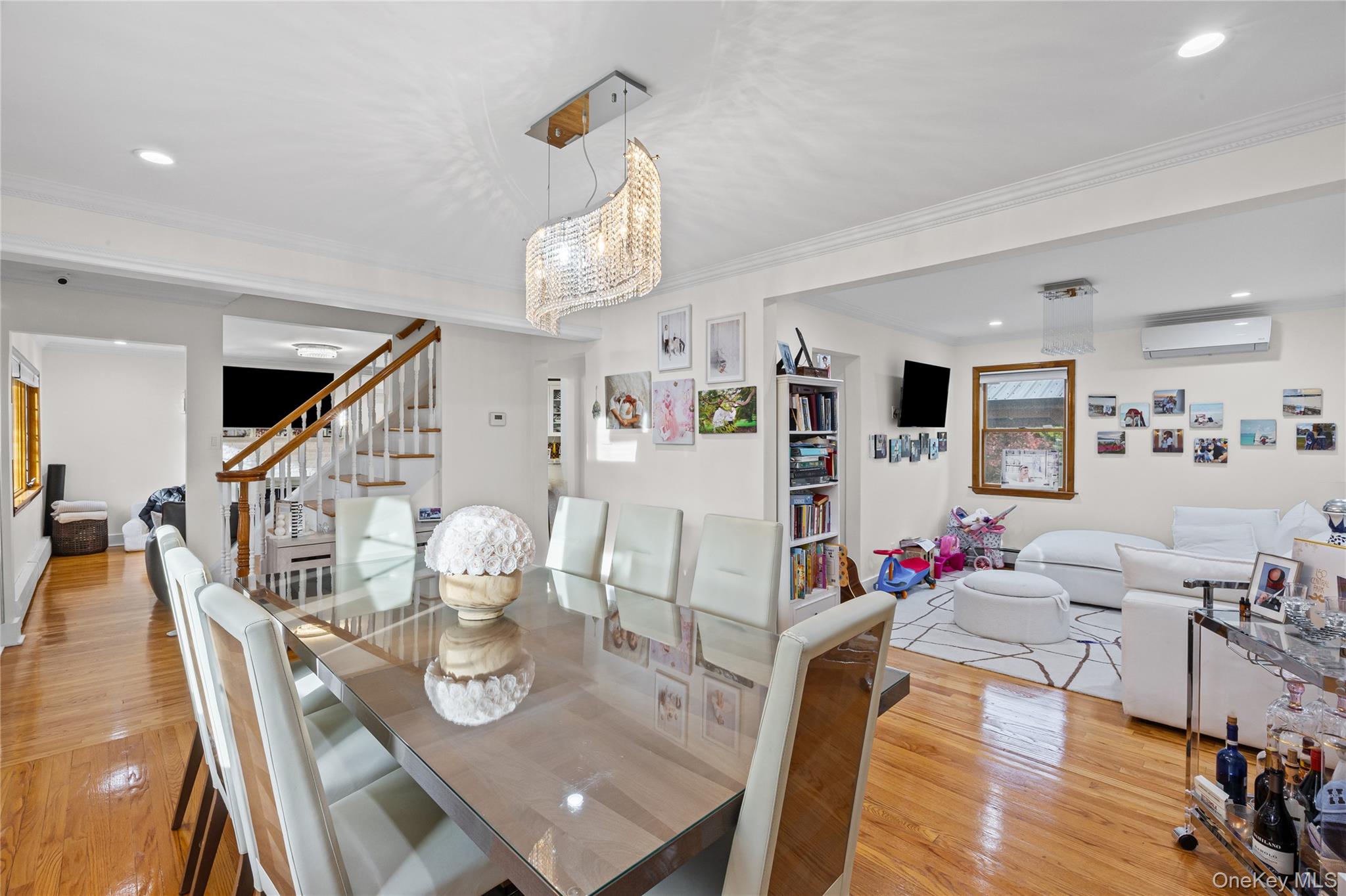 8 Willow Road New Hyde Park, NY 11040 - Photo 10 of 34 a living room with furniture kitchen view and a wooden floor