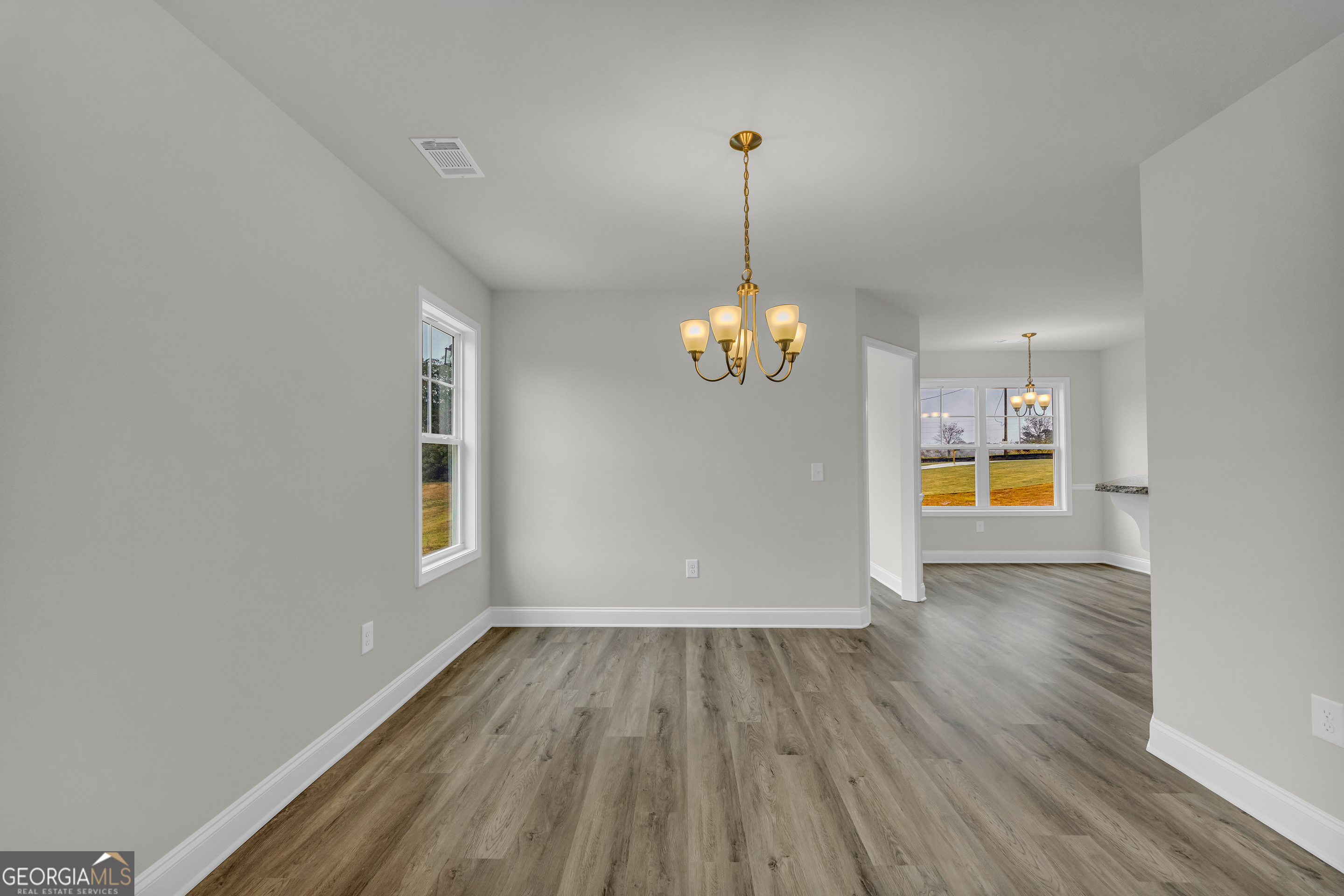 86 Sewell Road Lavonia, GA 30553 - Photo 14 of 67 a view of empty room with wooden floor and window
