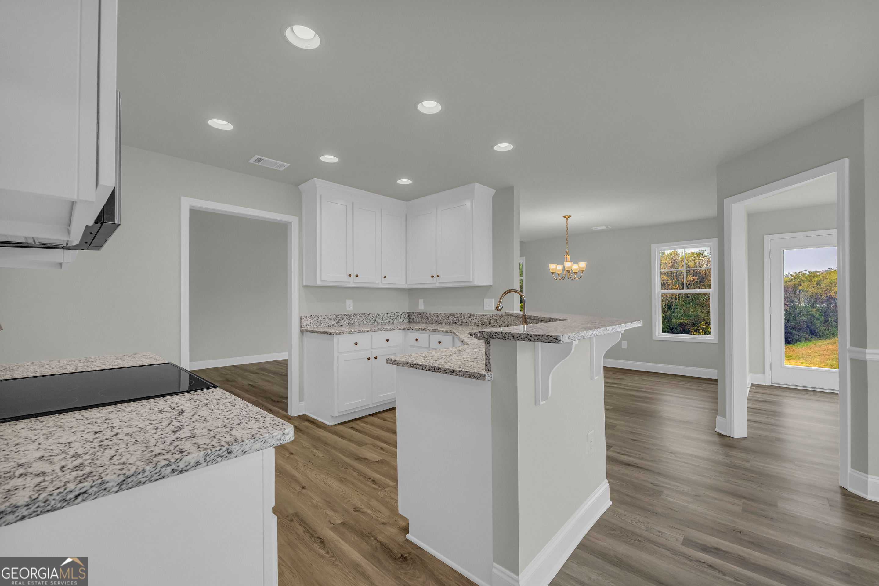 86 Sewell Road Lavonia, GA 30553 - Photo 24 of 67 a kitchen with a sink microwave and stove