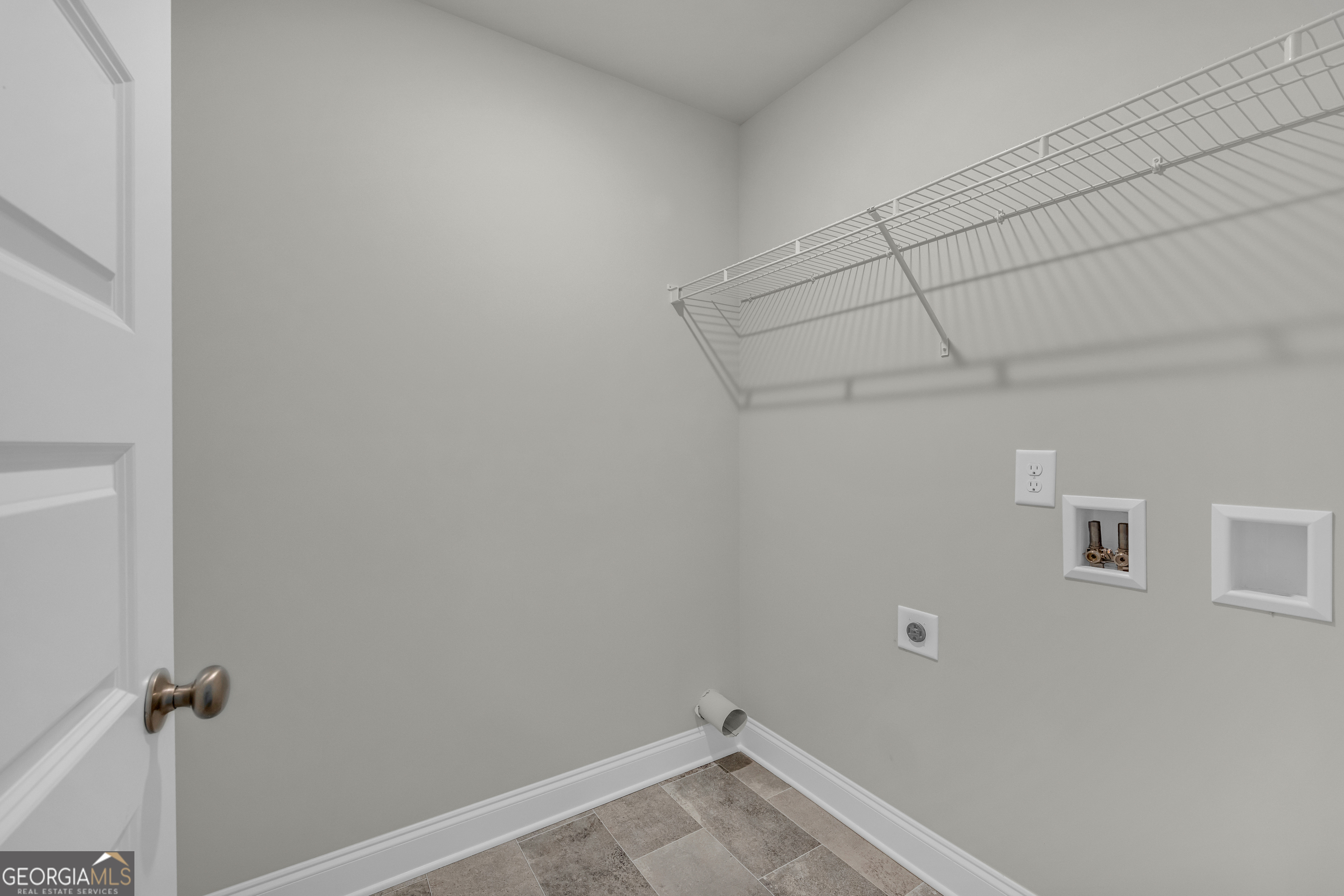 86 Sewell Road Lavonia, GA 30553 - Photo 25 of 67 a view of a room with racks on the wall