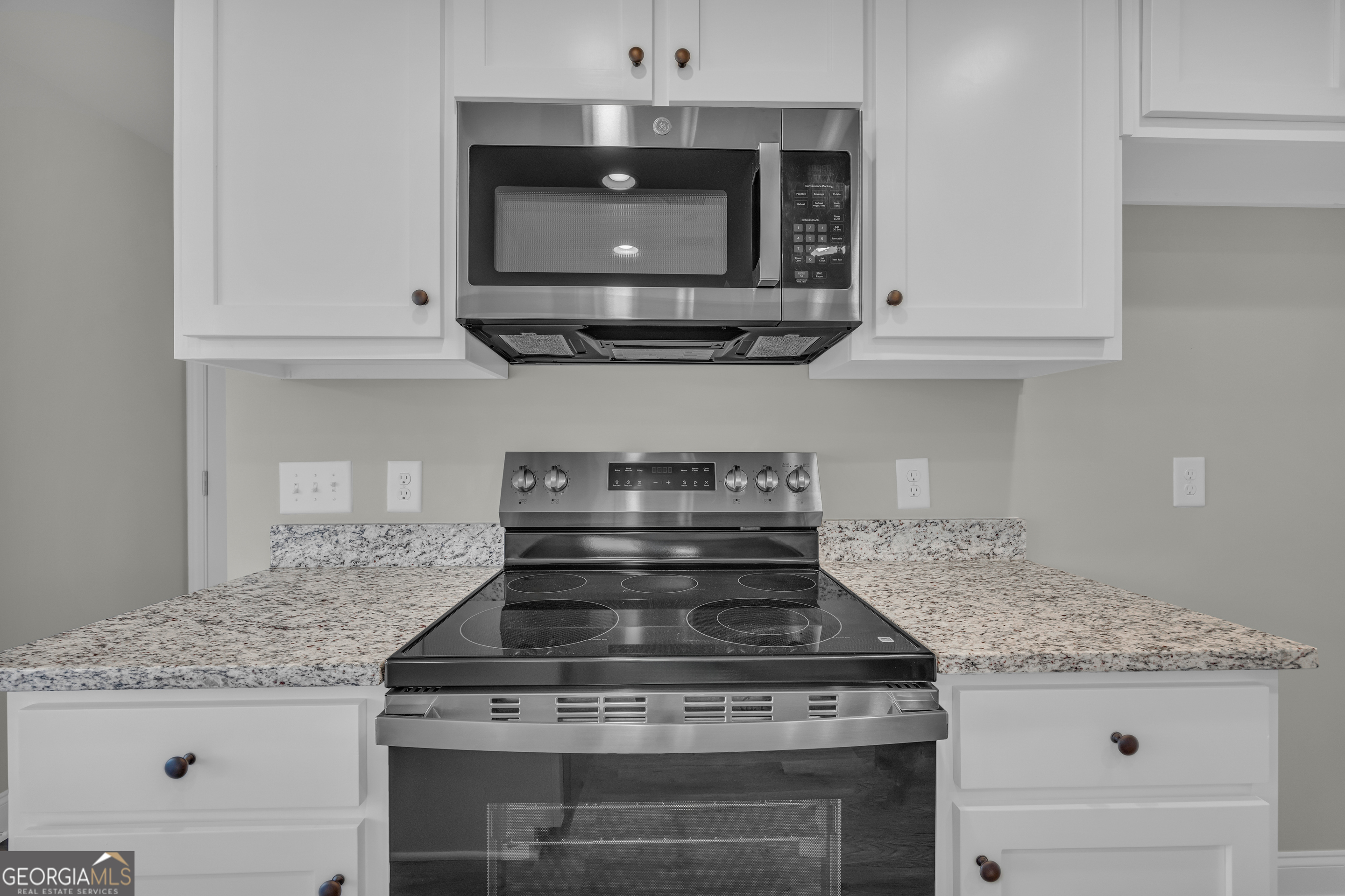 86 Sewell Road Lavonia, GA 30553 - Photo 34 of 67 a stove top oven sitting inside of a kitchen