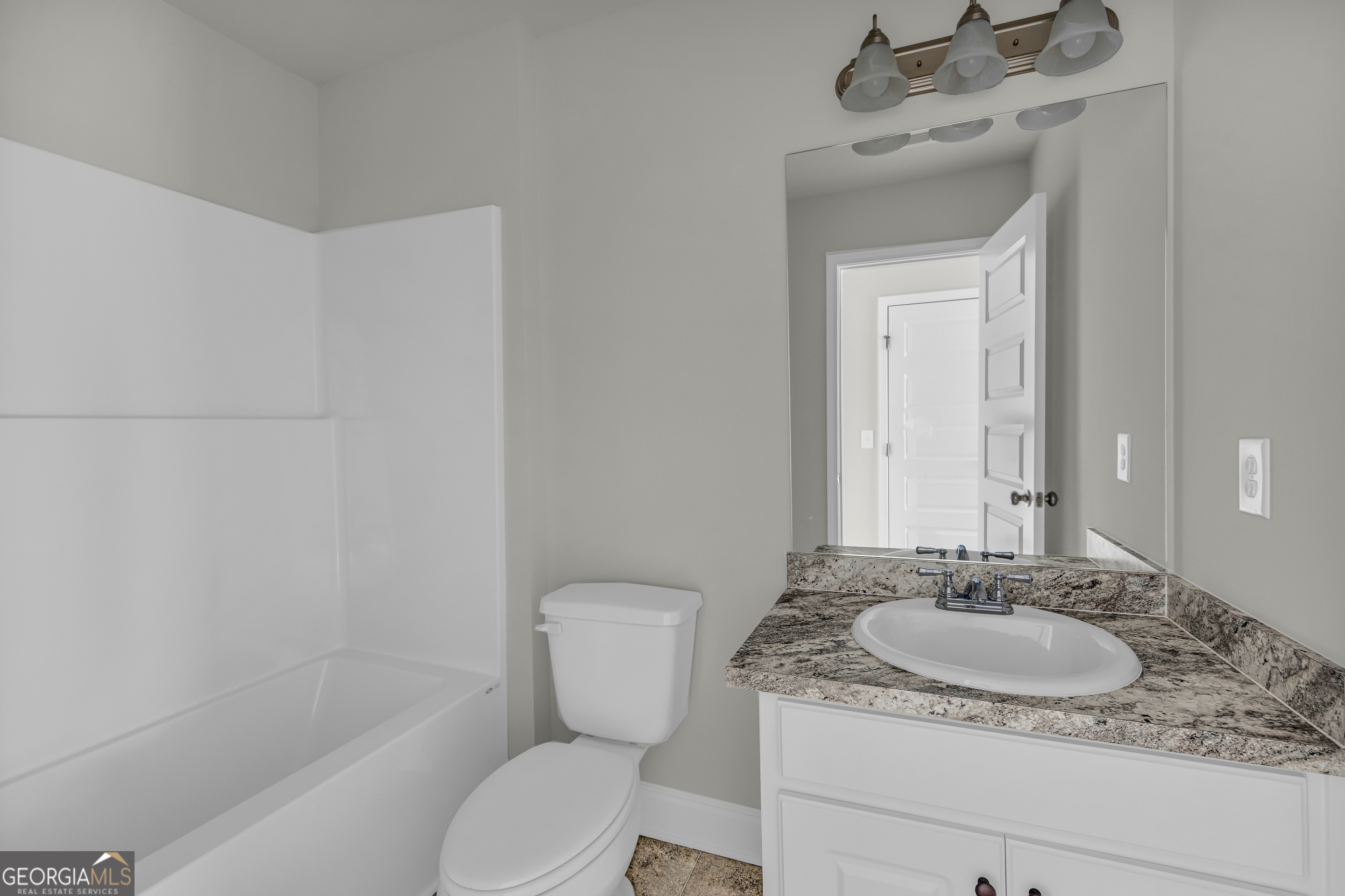 86 Sewell Road Lavonia, GA 30553 - Photo 39 of 67 a bathroom with a granite countertop sink toilet and shower