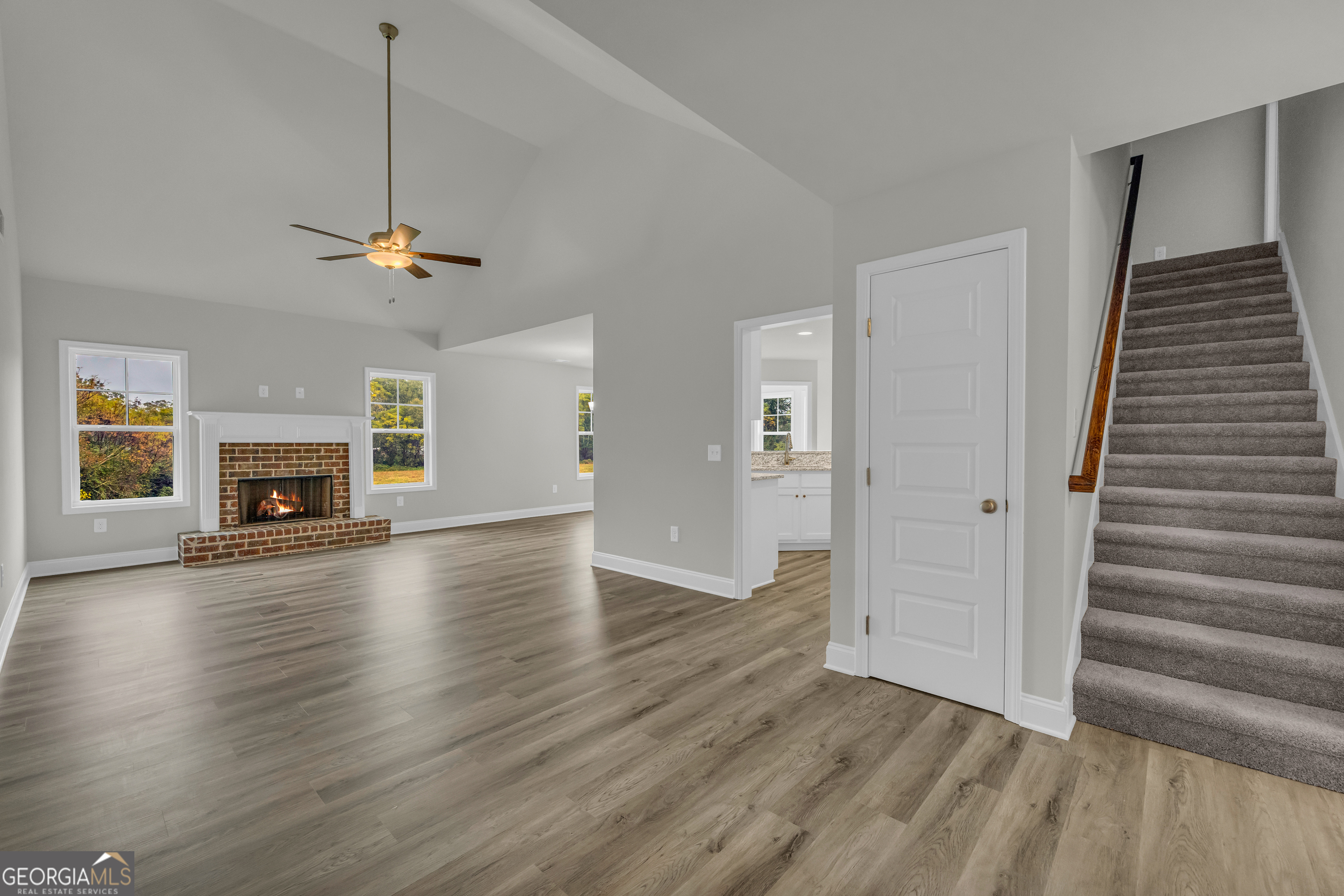 86 Sewell Road Lavonia, GA 30553 - Photo 5 of 67 a view of empty room with fireplace and wooden floor