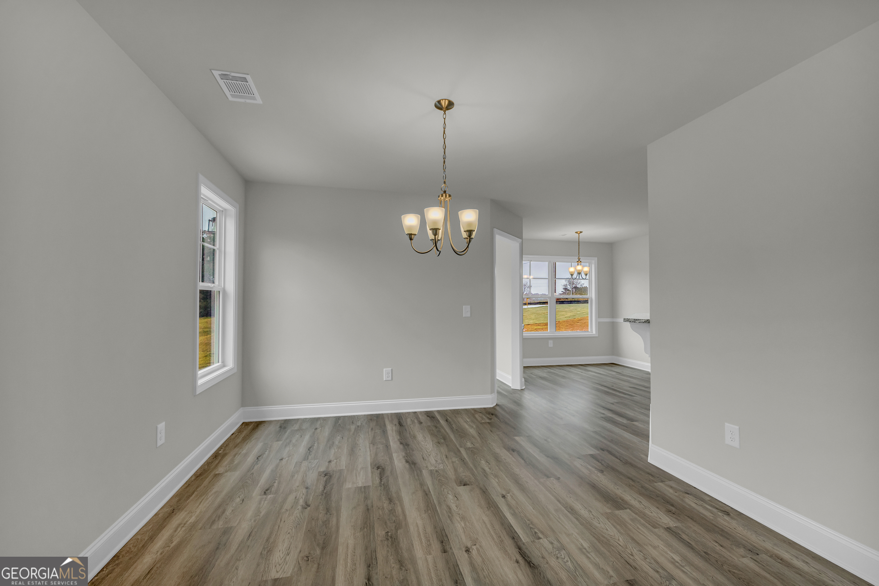 86 Sewell Road Lavonia, GA 30553 - Photo 10 of 67 a view of a room with wooden floor chandelier and a window