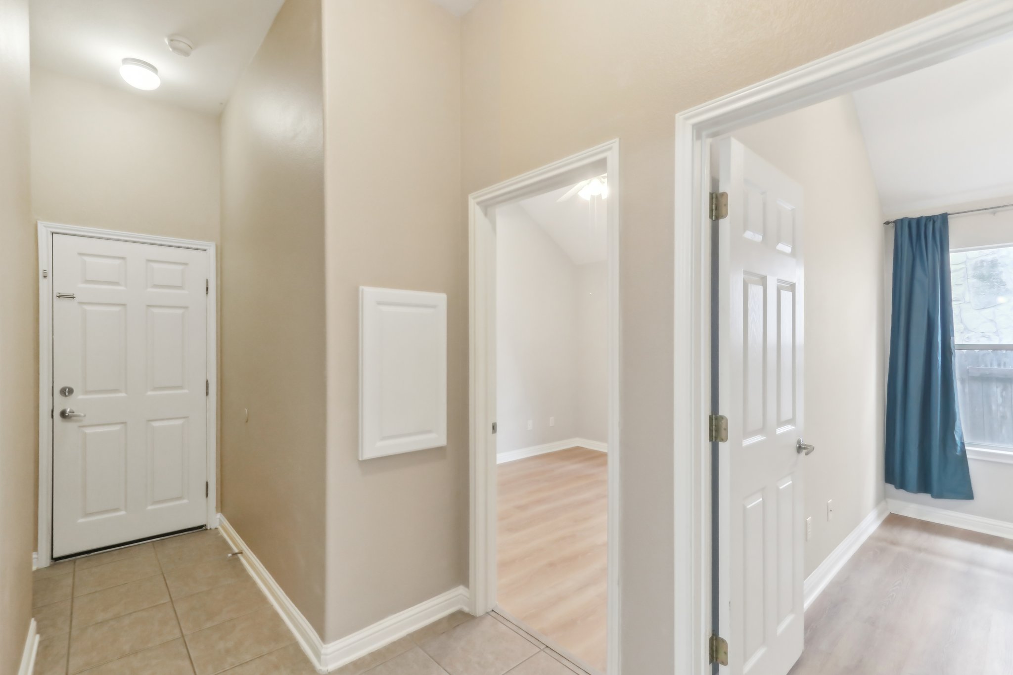 10108 Channel Island Drive Austin, TX 78747 - Photo 24 of 36 Corridor with lofted ceiling and light tile patterned floors