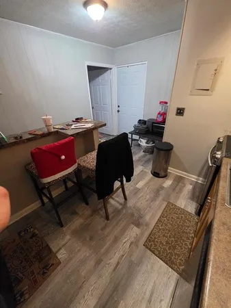 a living room with furniture and a rug