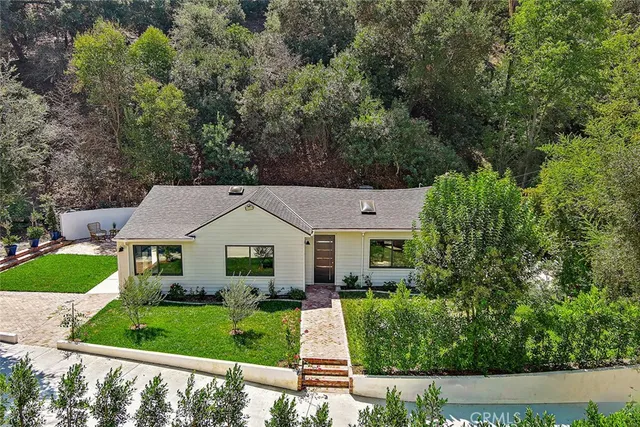 front view of a house with a yard