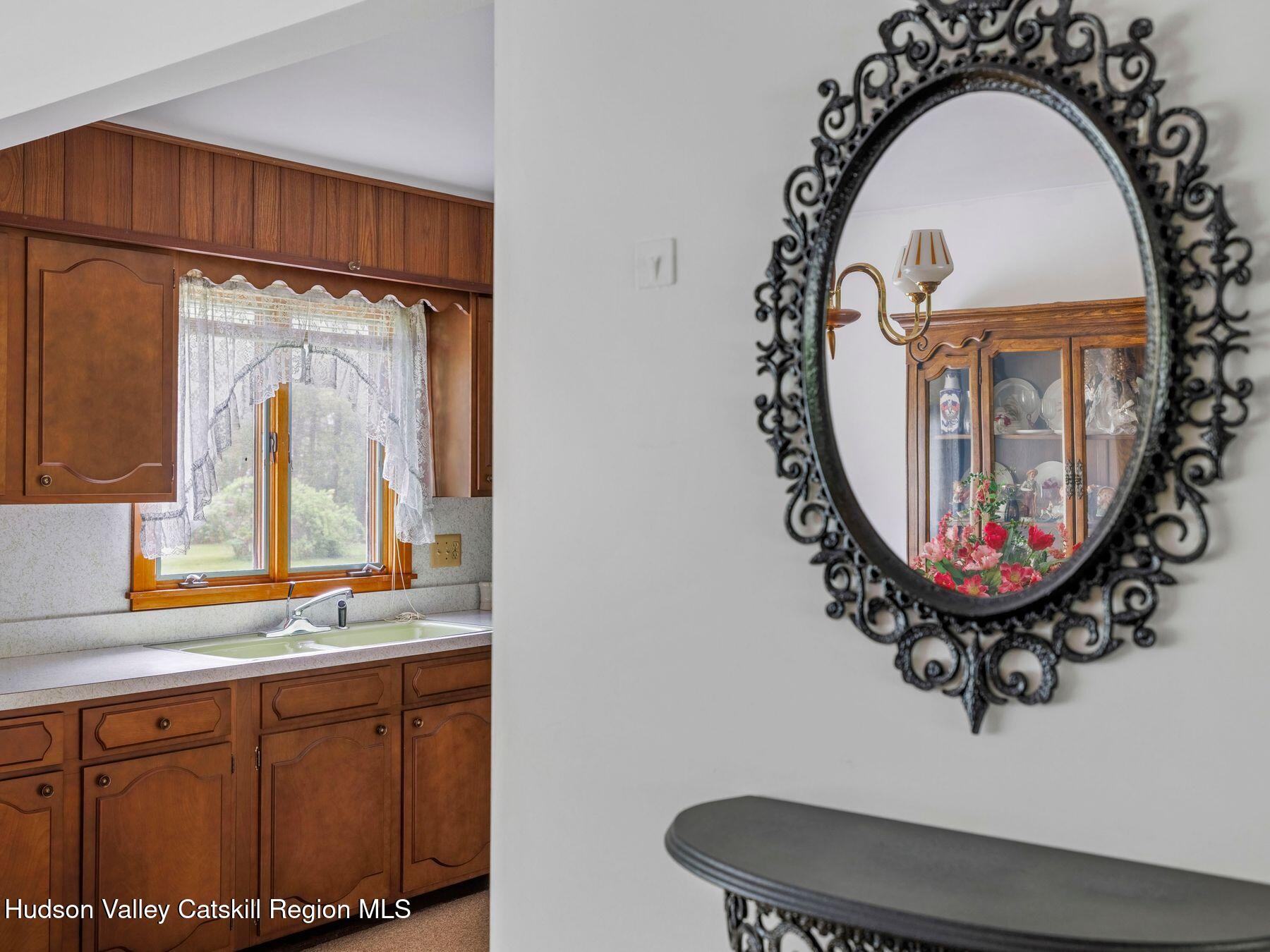 104 New Paltz Road Highland, NY 12528 - Photo 9 of 43 a bathroom with a sink mirror and window