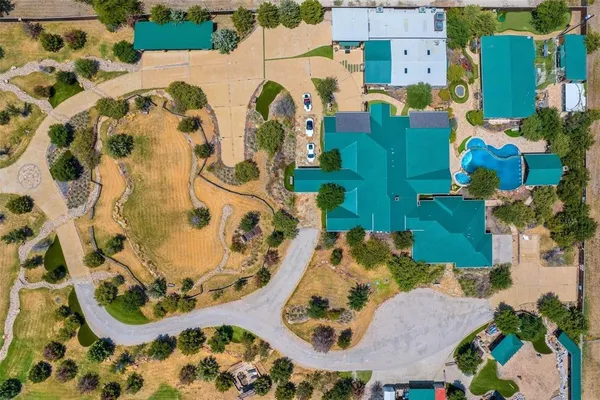 an aerial view of residential house with outdoor space