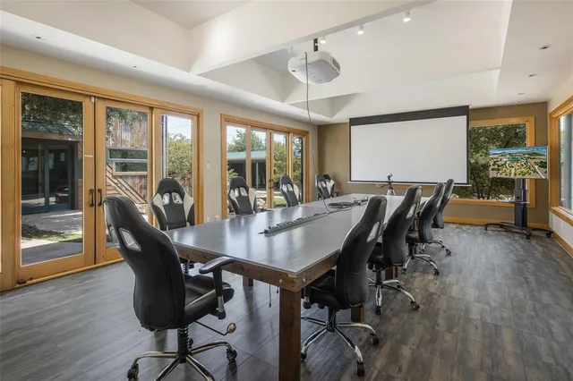 a view of lobby with a hallway and wooden floor