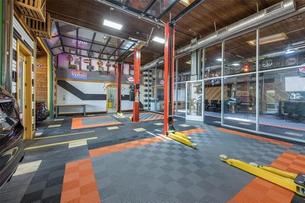 a view of a studio with wooden floor